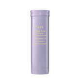 Oribe Serene Scalp Dry Shampoo Powder bottle close-up showing oil absorption for fresh roots.