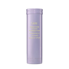 Oribe Serene Scalp Dry Shampoo Powder bottle close-up showing oil absorption for fresh roots.
