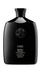 Oribe Signature Shampoo bottle delivers luxurious daily cleansing for silky hair.