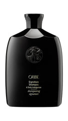Oribe Signature Shampoo bottle delivers luxurious daily cleansing for silky hair.
