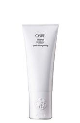 Oribe Silverati conditioner bottle close-up highlighting brightening for silver hair.