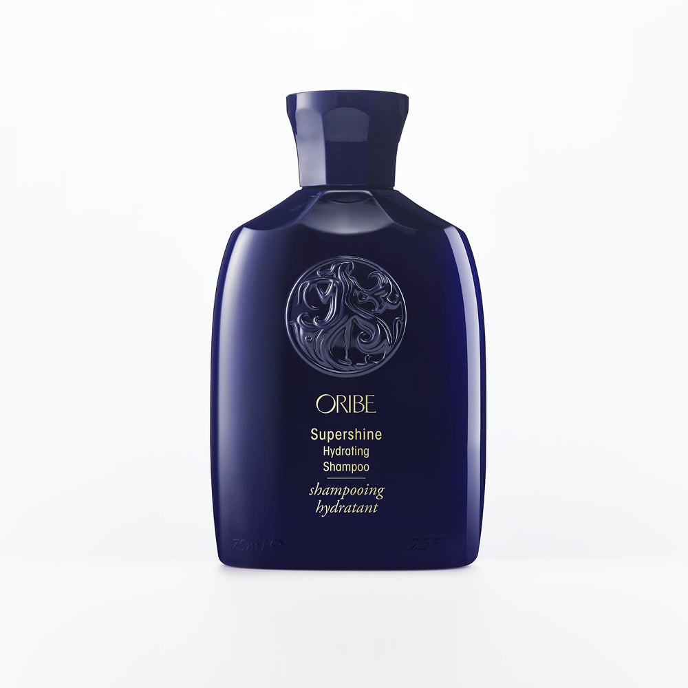 Oribe Supershine Hydrating Shampoo travel size bottle pour showcases premium formula for radiant shine