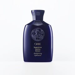 Oribe Supershine Hydrating Shampoo travel size bottle pour showcases premium formula for radiant shine