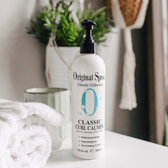 Original Sprout Curl Calmer hands dispense demonstrates easy application for damp or dry hair.