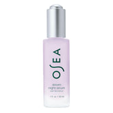 OSEA Dream Night Serum bottle on a white surface for a soothing nighttime routine.
