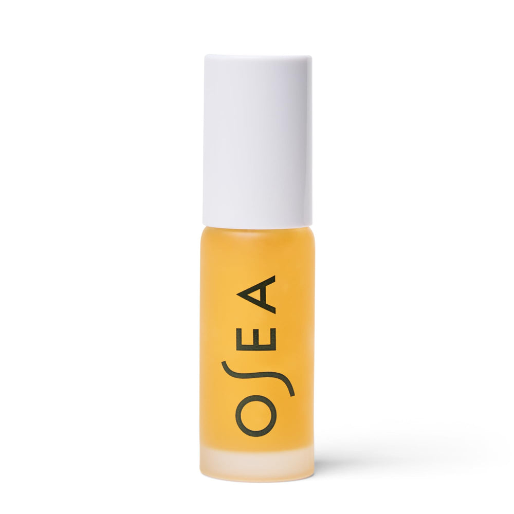 OSEA Hyaluronic Lip Oil Booster clear gloss bottle delivering instant shine and hydration.