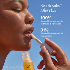 Visible lip volume enhancement with OSEA Lip Oil Booster for plumper look.