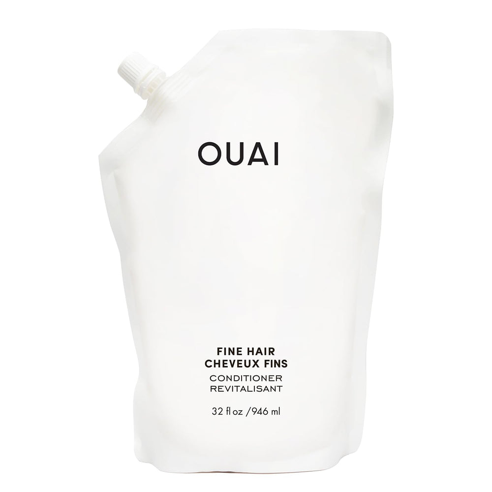 OUAI Fine Hair Conditioner refill bottle close-up showing sleek packaging for voluminous hair.