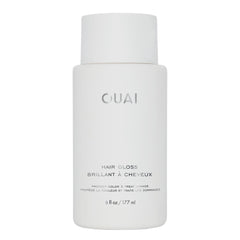 OUAI Hair Gloss bottle in shower showing shine enhancement for glossy hair