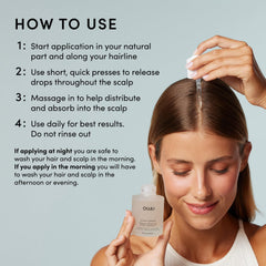 Applying OUAI Scalp Serum to the scalp.