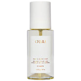 OUAI St. Barts hair and body mist bottle close-up, tropical freshness for hair and skin.