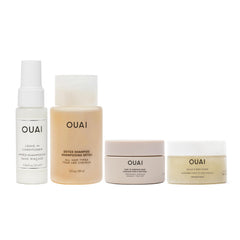 OUAI Travel Kit packaging with four travel-sized bottles for on-the-go routines