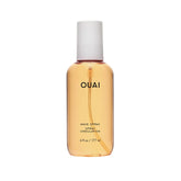OUAI Wave Spray bottle close-up showing texture and shine for hair styling
