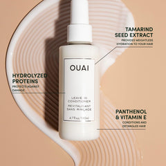 OUAI wave spray mist on hair for added shine and texture.