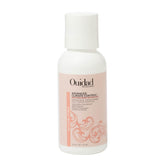 Ouidad Advanced Climate Control Defrizzing Conditioner bottle close-up highlighting frizz control.
