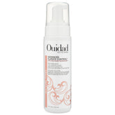 Ouidad advanced climate control foam bottle closeup for lightweight volumizing and frizz control.