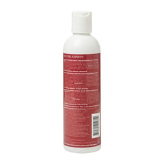 Ouidad travel-size gel on bathroom shelf ready for humidity defense on the go