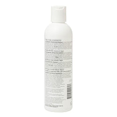 Ouidad Curl Quencher bottle pump demonstrating easy, gentle cleansing for tight curls.