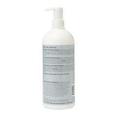 Ouidad Curl Quencher conditioner applied to hair for detangling ease.