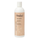 Ouidad Curl Shaper Good As New shampoo bottle, gentle cleanse for soft, defined curls.