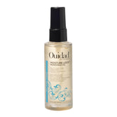 Ouidad Moisture Lock Mongongo Oil bottle pour demonstrates quick absorption for curls.