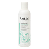 Ouidad VitalCurl+ muestra la botella vertido para limpieza suave y humedad.