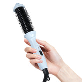 Ouphiny dual-voltage heated round brush with blue ceramic barrel for smooth styling.
