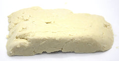 Our Earth's Secrets Manteca Karité Ivory textura crema, ideal para hidratación diaria.