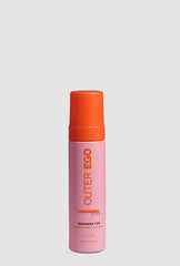 Outer Ego Express Tan Mousse bottle shows violet undertone for a natural bronze glow