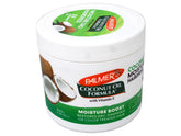 Palmer's Coconut Oil Moisture Gro bottle pour for deep hydration on curls.