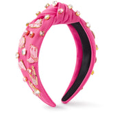 Pantide diadema vaquera con joyas y nudo rosa intenso, ideal para looks glamorosos.