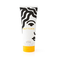 PATTERN Heavy Conditioner bottle closeup highlighting rich texture for detangling and hydration.
