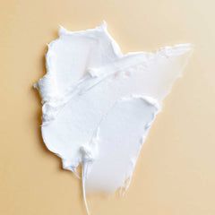 PATTERN Styling Cream texture swirls on fingers for moisture and elongation.