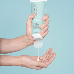 Paul Mitchell Hydrate Conditioner pump demonstrates easy, even application for nourished strands.