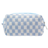PAZIMIIK checkered makeup bag in blue stands upright for easy access to cosmetics.