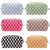 PAZIMIIK checkered makeup bag stands upright for easy access to cosmetics on the go.