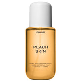 PHLUR Peach Skin Body Mist bottle with peach bellini notes for daily freshness.