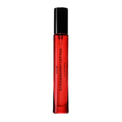 PHLUR Strawberry Letter travel-size bottle for on-the-go fragrance.