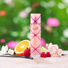 Pink Sugar bottle close-up highlights gourmand notes and branding.