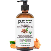 Aceite de almendras orgánico PURA D'OR en envase de vidrio para piel suave y nutrida.