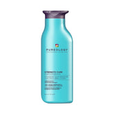 Pureology Strength Cure Shampoo bottle shows vegan, sulfate-free formula for damaged or color-treated hair.