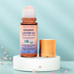 Queen of the Thrones Organic Golden Castor Oil glass bottle close-up highlighting purity and hexane-free formula.