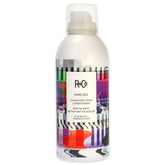 R+Co ANALOG cleansing foam bottle for weightless conditioning.