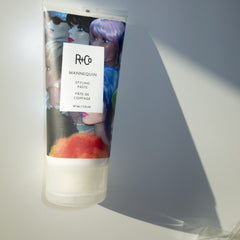 R+Co MANNEQUIN hands applying paste for textured styling and movement