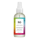 R+Co Mood Swing Straightening Spray bottle shows heat-activated shine and humidity protection.