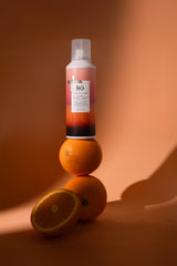 R+Co Sun Catcher mist being applied for quick refresh and hydration.