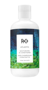 R+Co Atlantis bottle showcases rich hydration for dry hair.