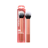 Real Techniques Skin Tint Base Brush in full-face application pose for even coverage
