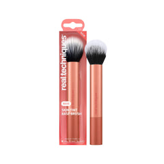 Real Techniques Skin Tint Base Brush in full-face application pose for even coverage