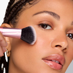 Real Techniques Ultimate Multi-Tasker Brush blends bronzer and blush with buildable coverage.